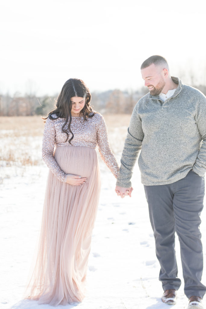 Expecting Mom and Dad in a field during Maternity Portrait Session